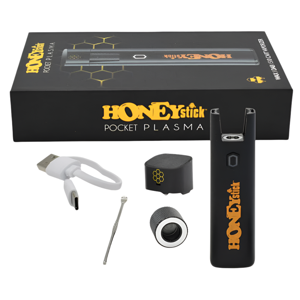he Honeystick Pocket Plasma vaporizer kit displayed with accessories, including a USB charger, dab tool, and additional components.