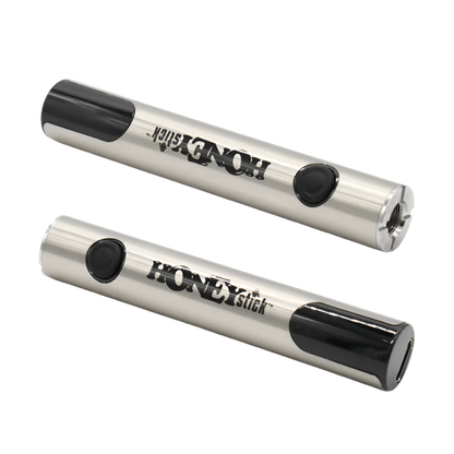Two HoneyStick Digital 510 batteries positioned horizontally, showcasing the black and silver design, LED display, and 510 thread connection.
