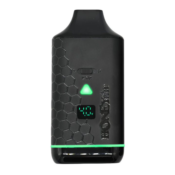 A close-up view of the Honeystick Duo XL vape battery, showing the green LED display indicating the current voltage setting.