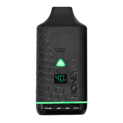 A close-up view of the Honeystick Duo XL vape battery, showing the green LED display indicating the current voltage setting.