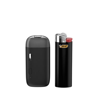Jupiter CCELL AIO Voca Pro next to a standard black Bic lighter for size comparison.