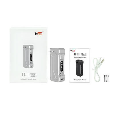 The Yocan UNI Pro box mod kit displayed with packaging, user manual, Micro USB cable, and a magnetic 510-thread adapter.

